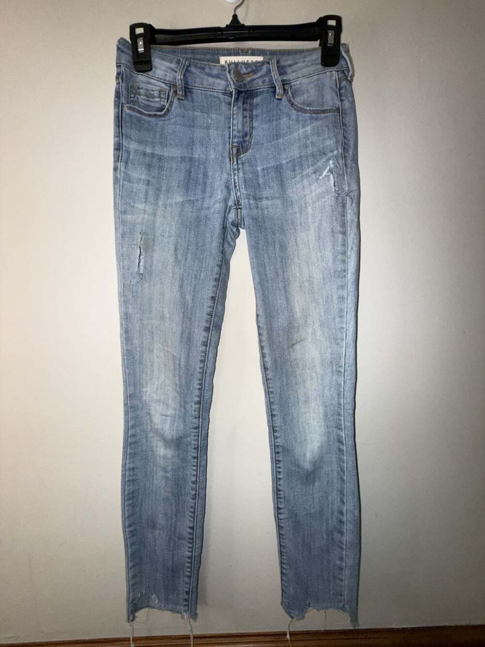 Bullhead Denim Co. Mid Rise Skinniest Distressed Raw Hem Jeans